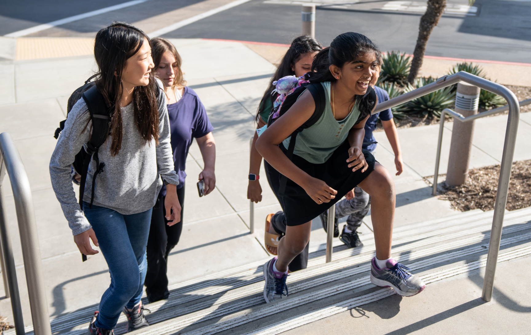 Students climbing steps